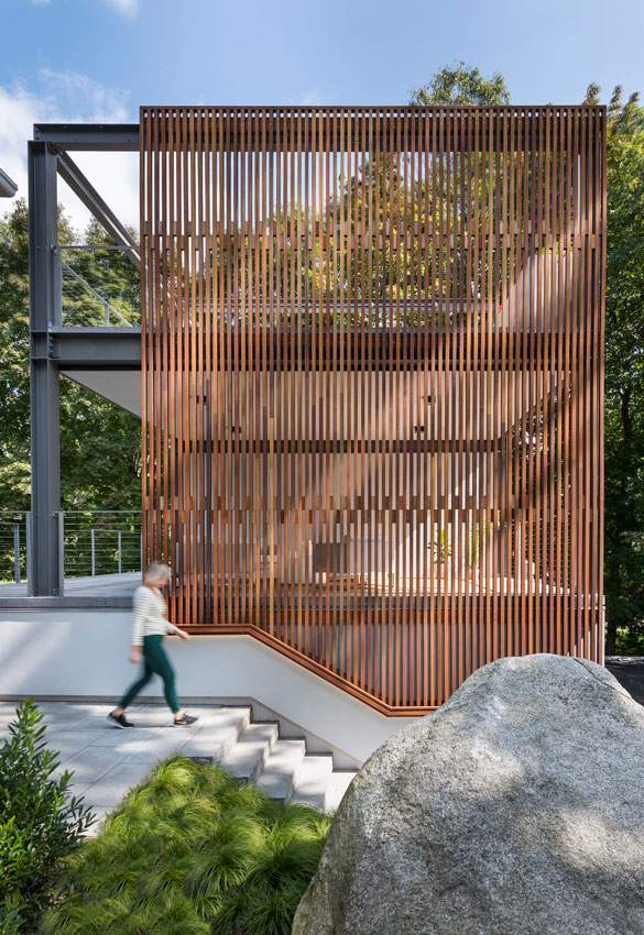 3-story outdoor structure with wood screen
