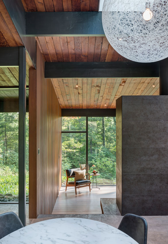 mid-century modern wood ceiling and floor to ceiling glass